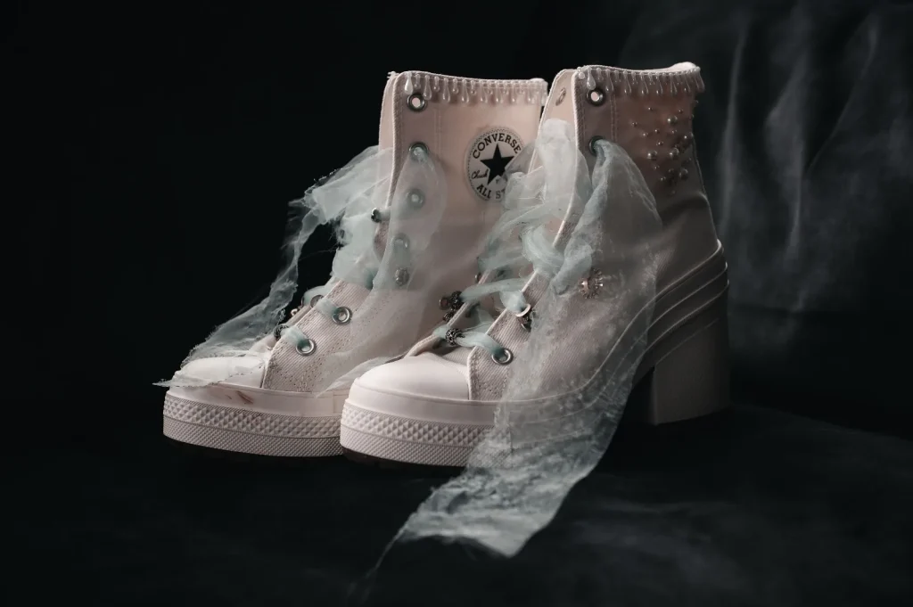 Pearl-studded white Converse wedding boots with tulle laces